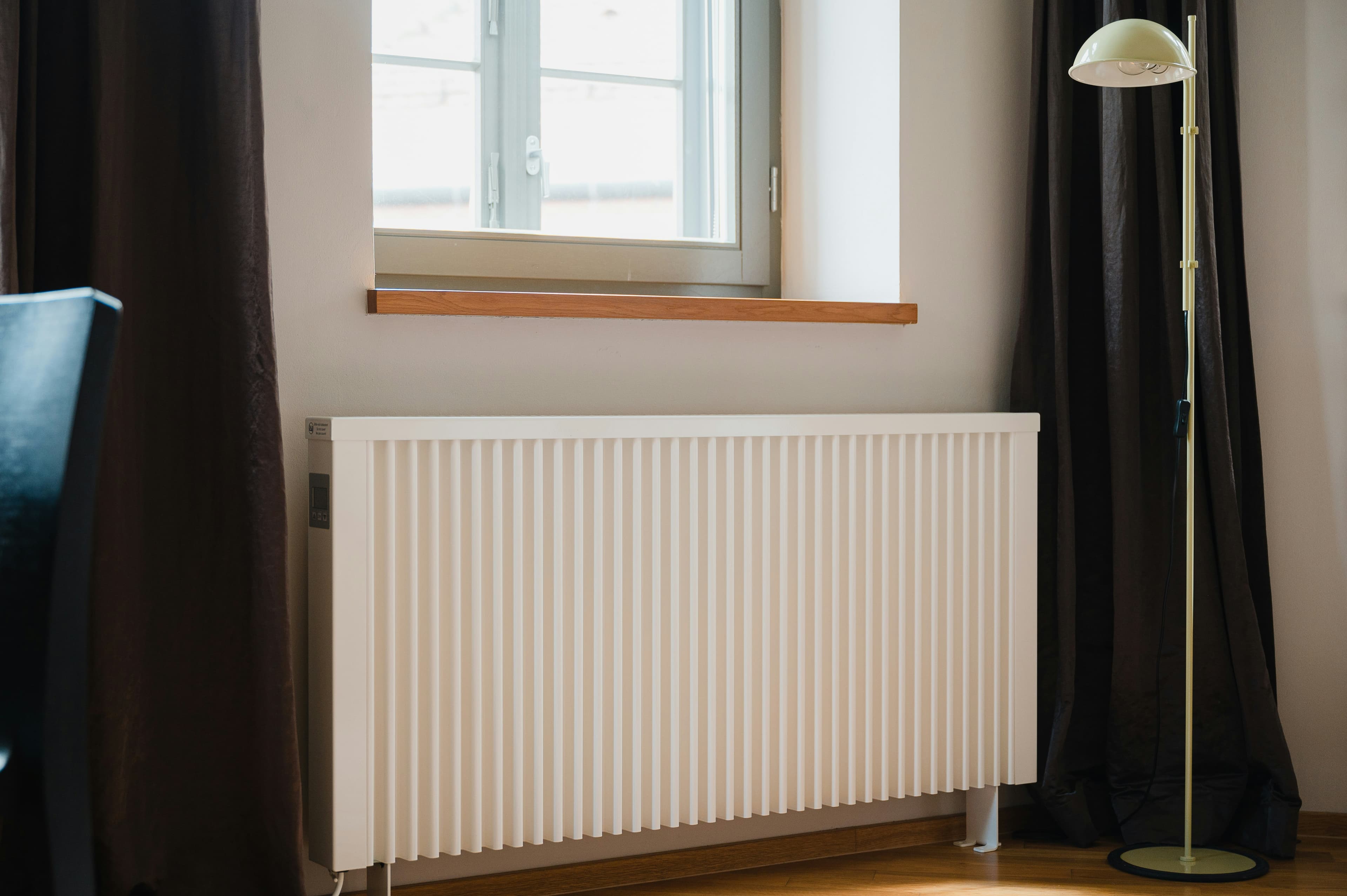 A panel radiator under a window