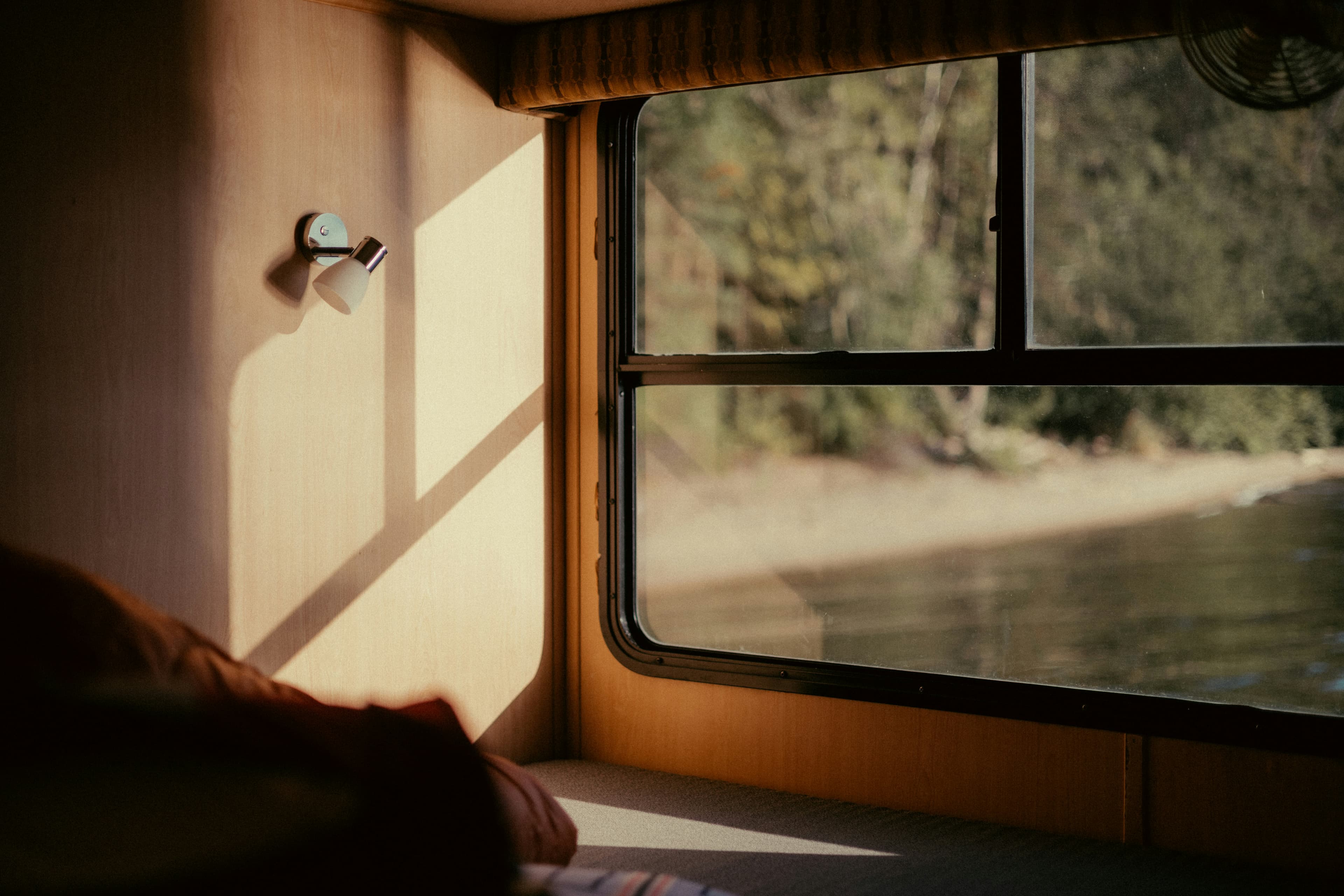 Sunlight falling across a bedroom